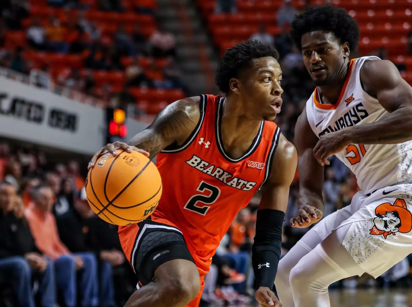 Qua Grant drives against Oklahoma State