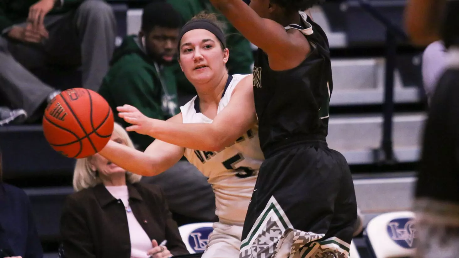 anne lehr looks to pass around a defender