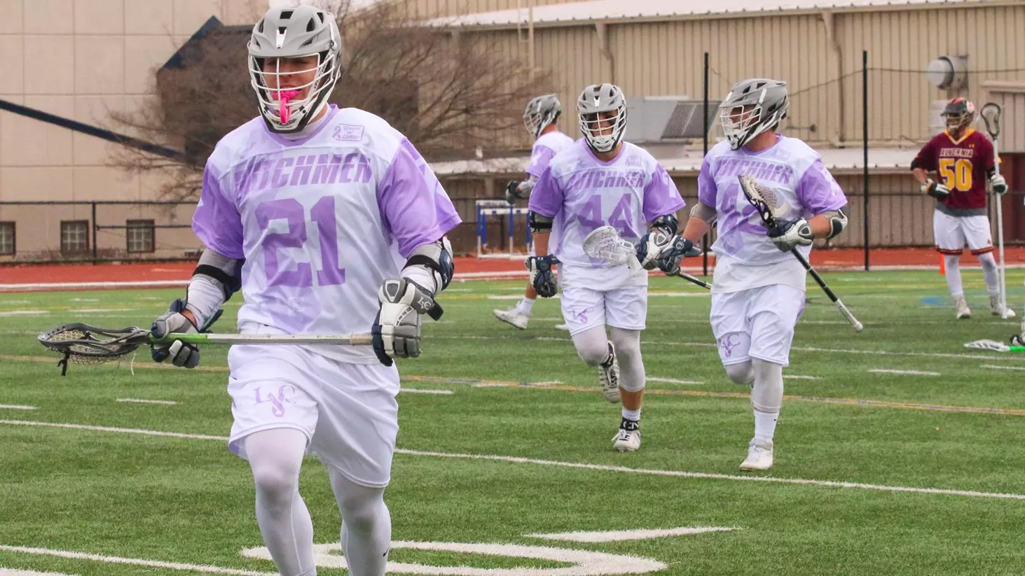 kevin beaver, matt torrence, and mason hoff celebrate after a goal on crosse out cancer day