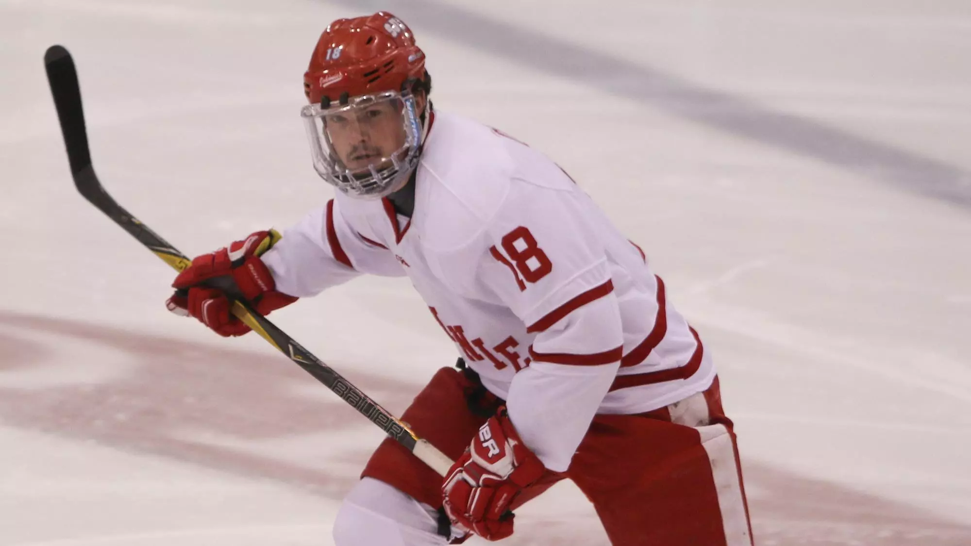 Evan Okeley skates up the ice