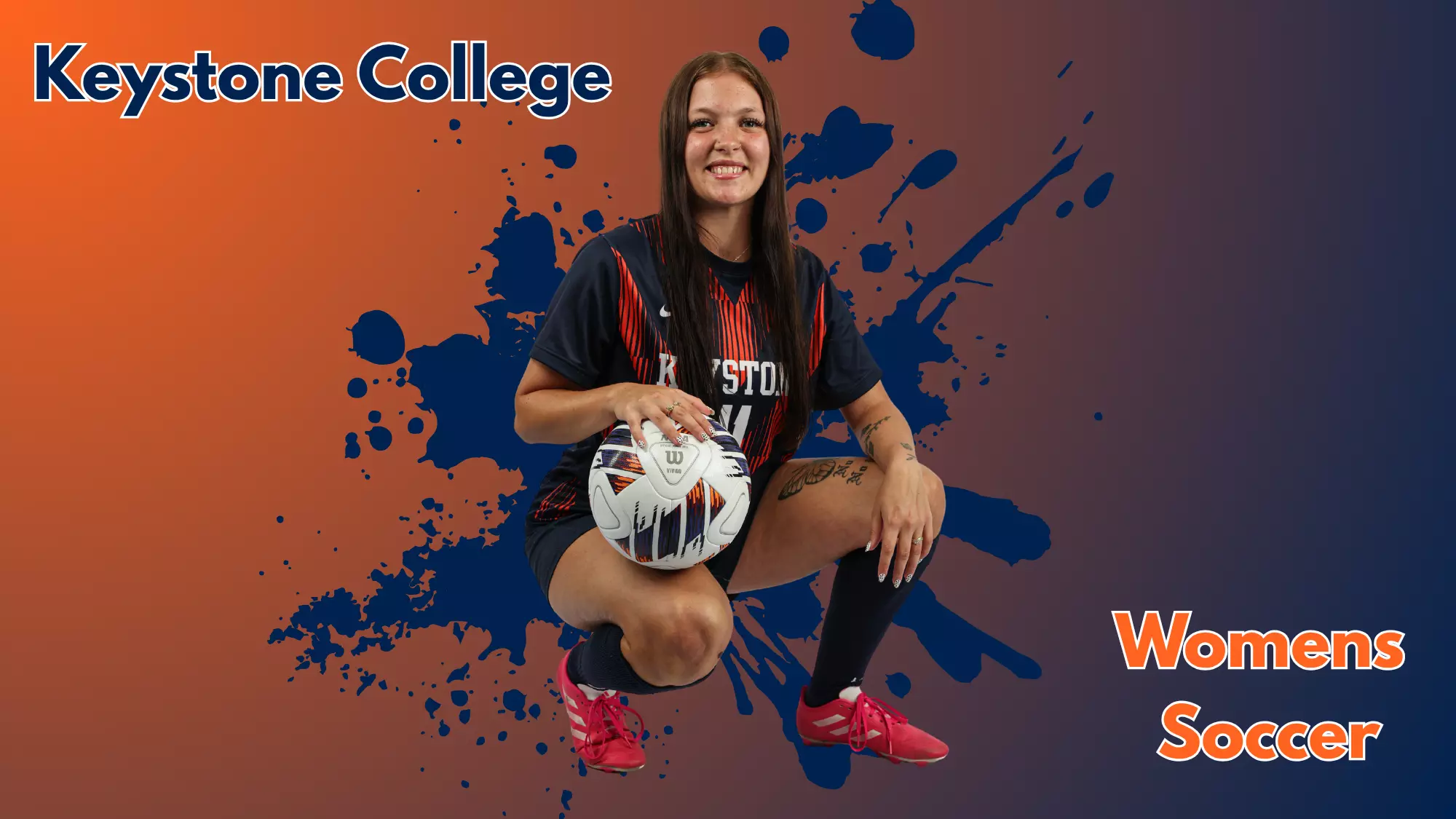 Keystone College women’s soccer player posing with a soccer ball in uniform.