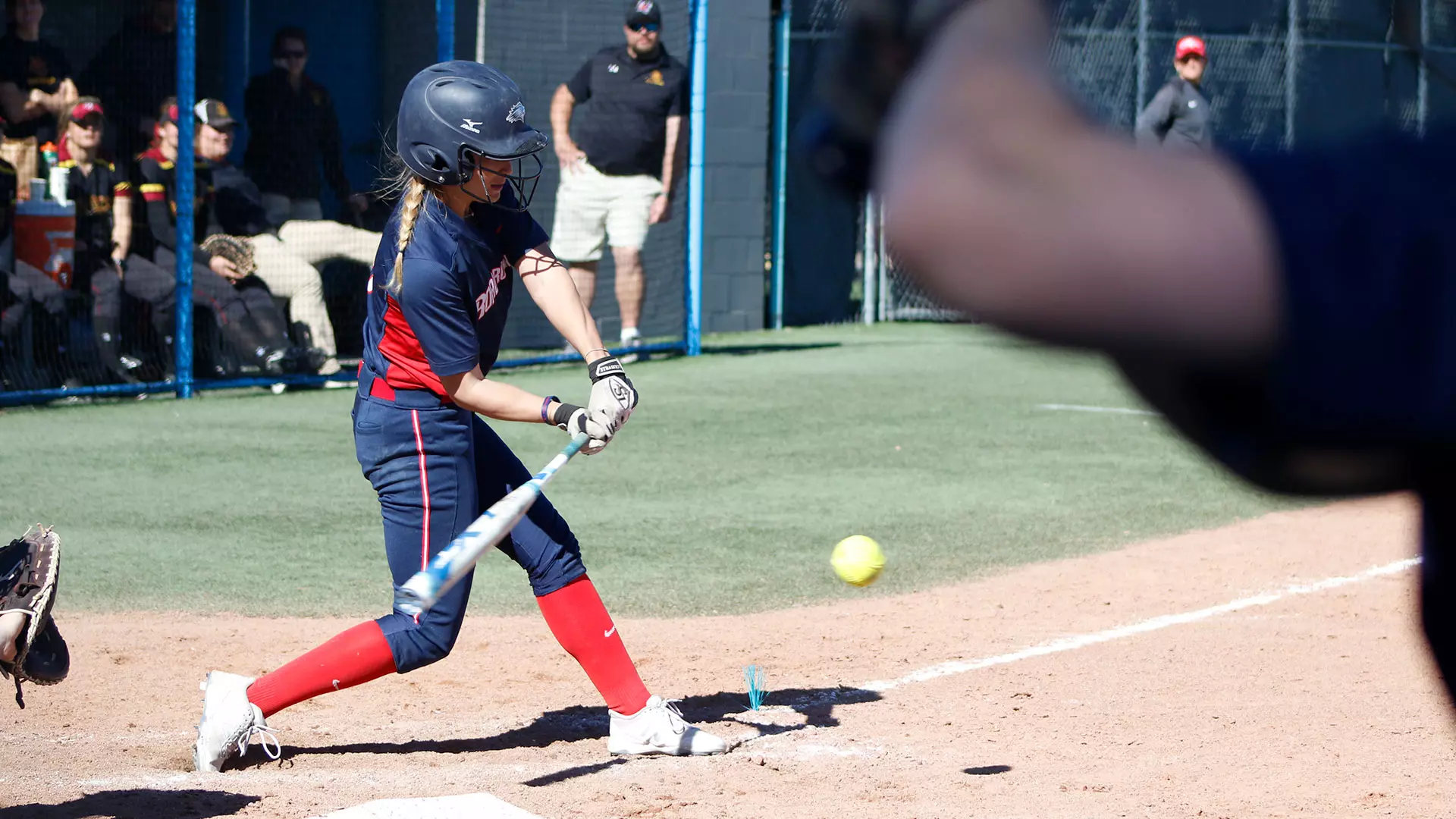 MSU Denver player swings closely to the ball