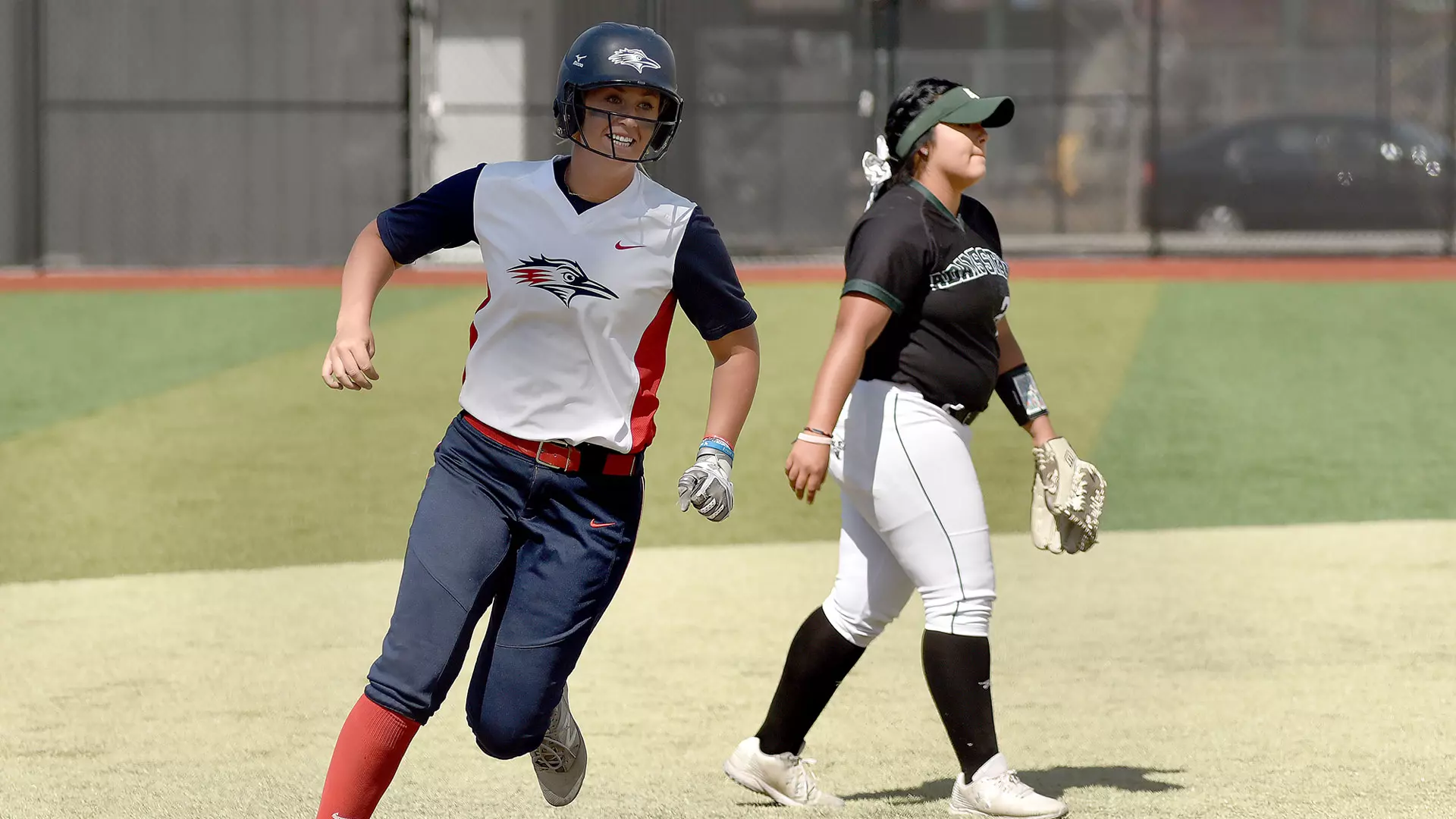 MSU Denver player running past  opponent 