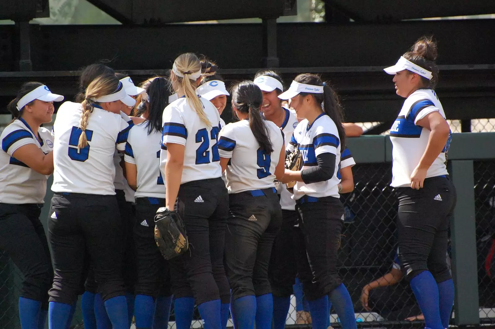 Team huddles between innings vs. Fullerton.