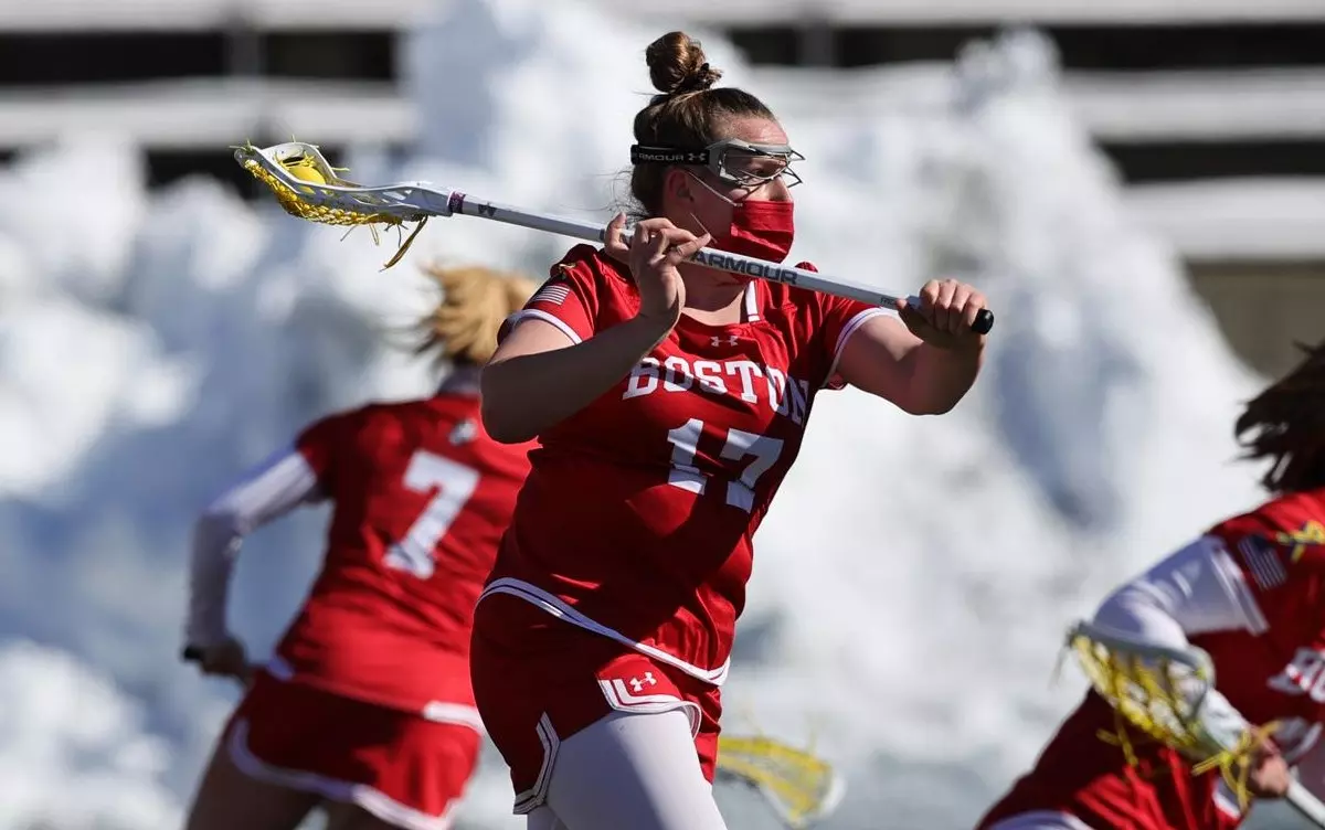Maggie Lohrer with her stick back and ready to pass