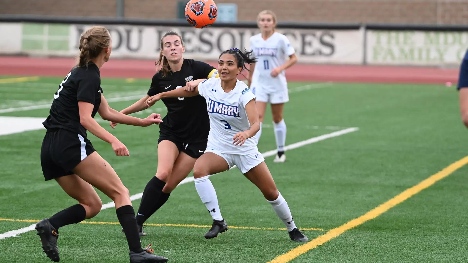 Kayla Alcott fights for the ball against the Yellowjackets