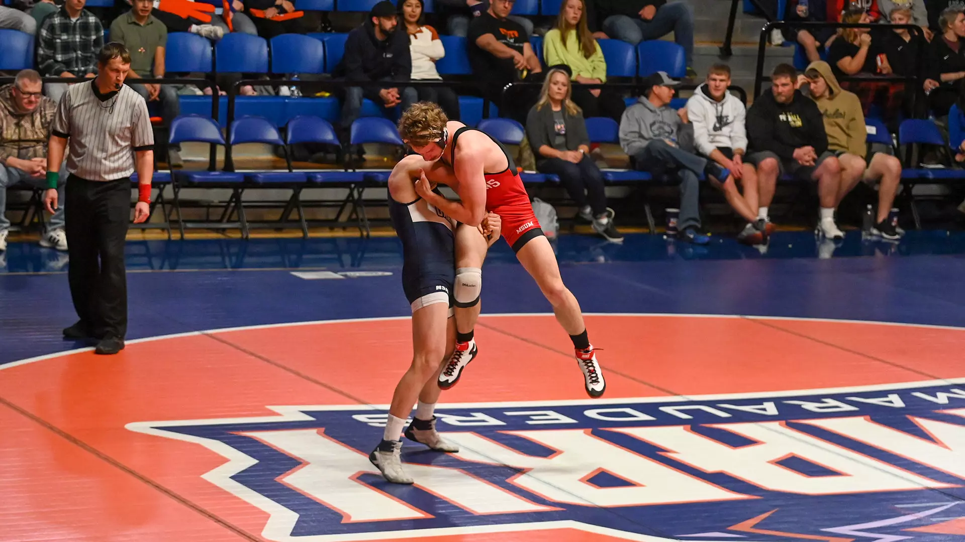 UMary Wrestling slam against MSUM