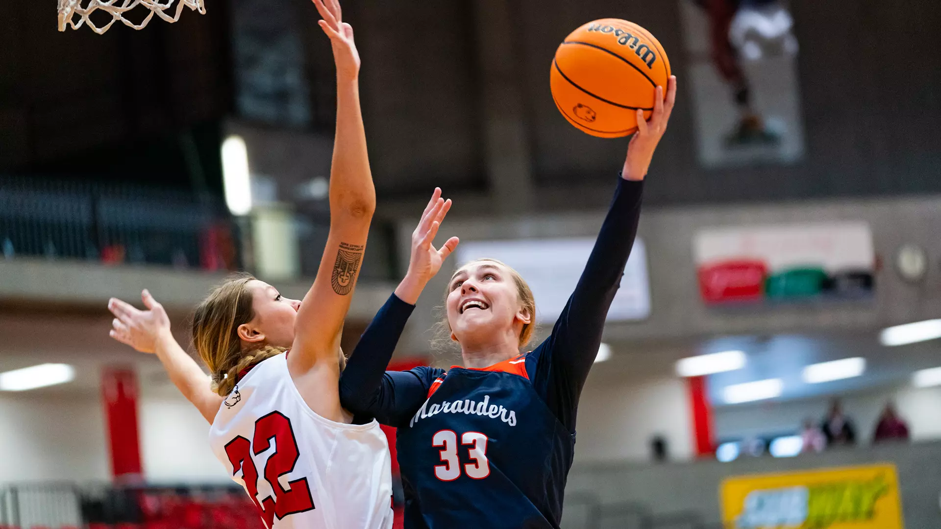 Addison Rozell goes up to the basket against a Minot defender