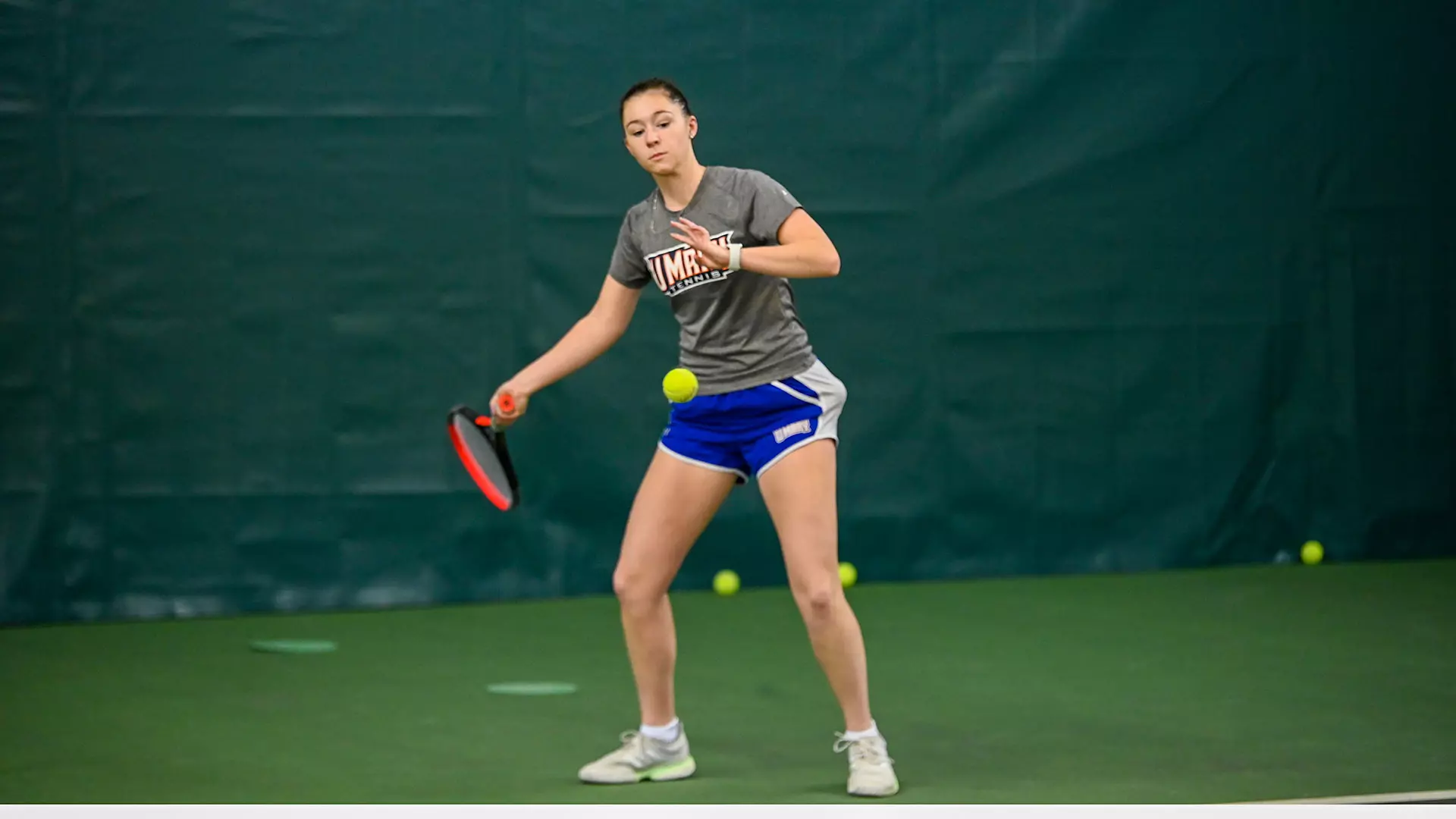 Emily Needham returning the ball