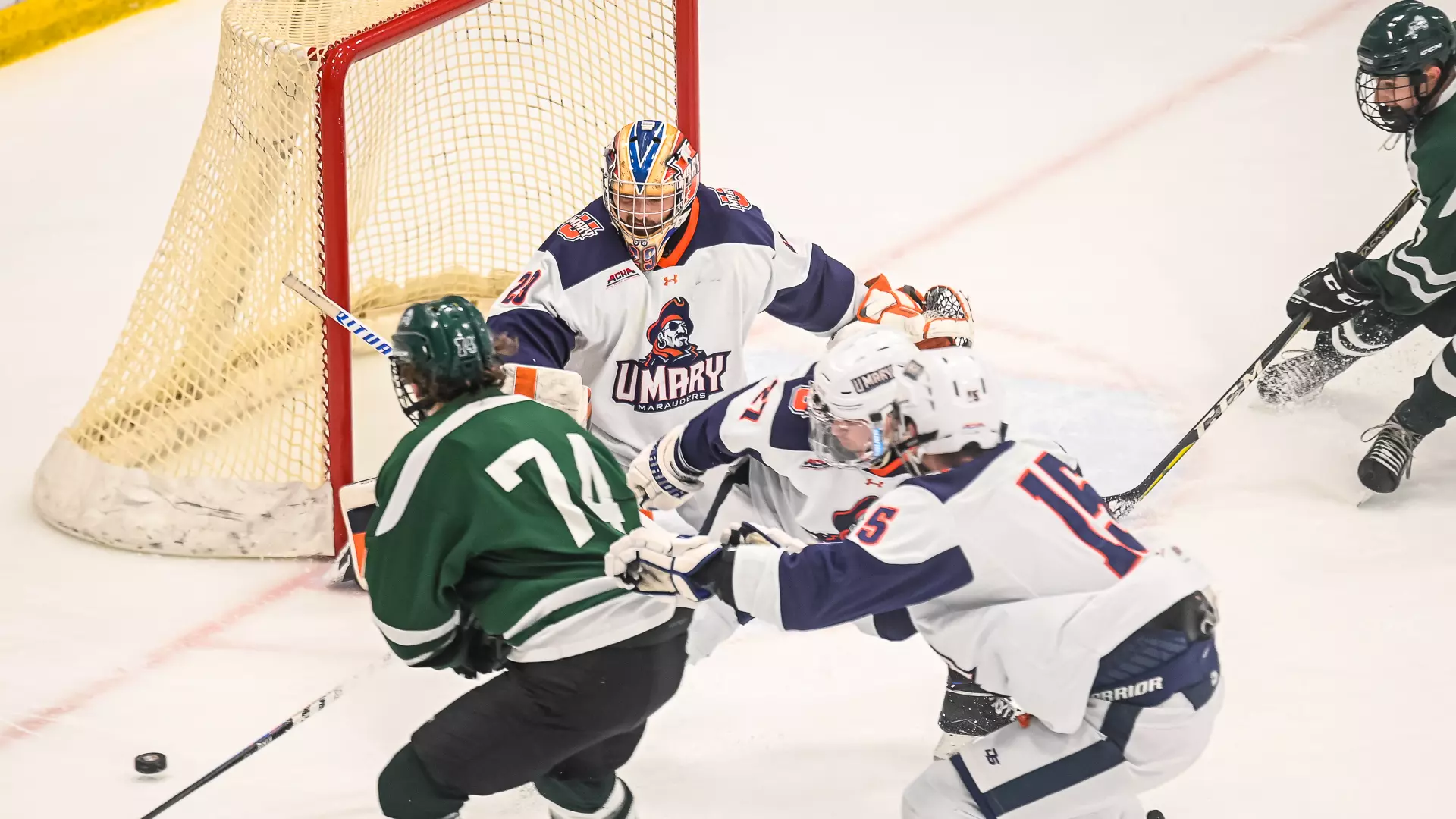 Kyle Hayden turns the puck away from the Lumberjacks