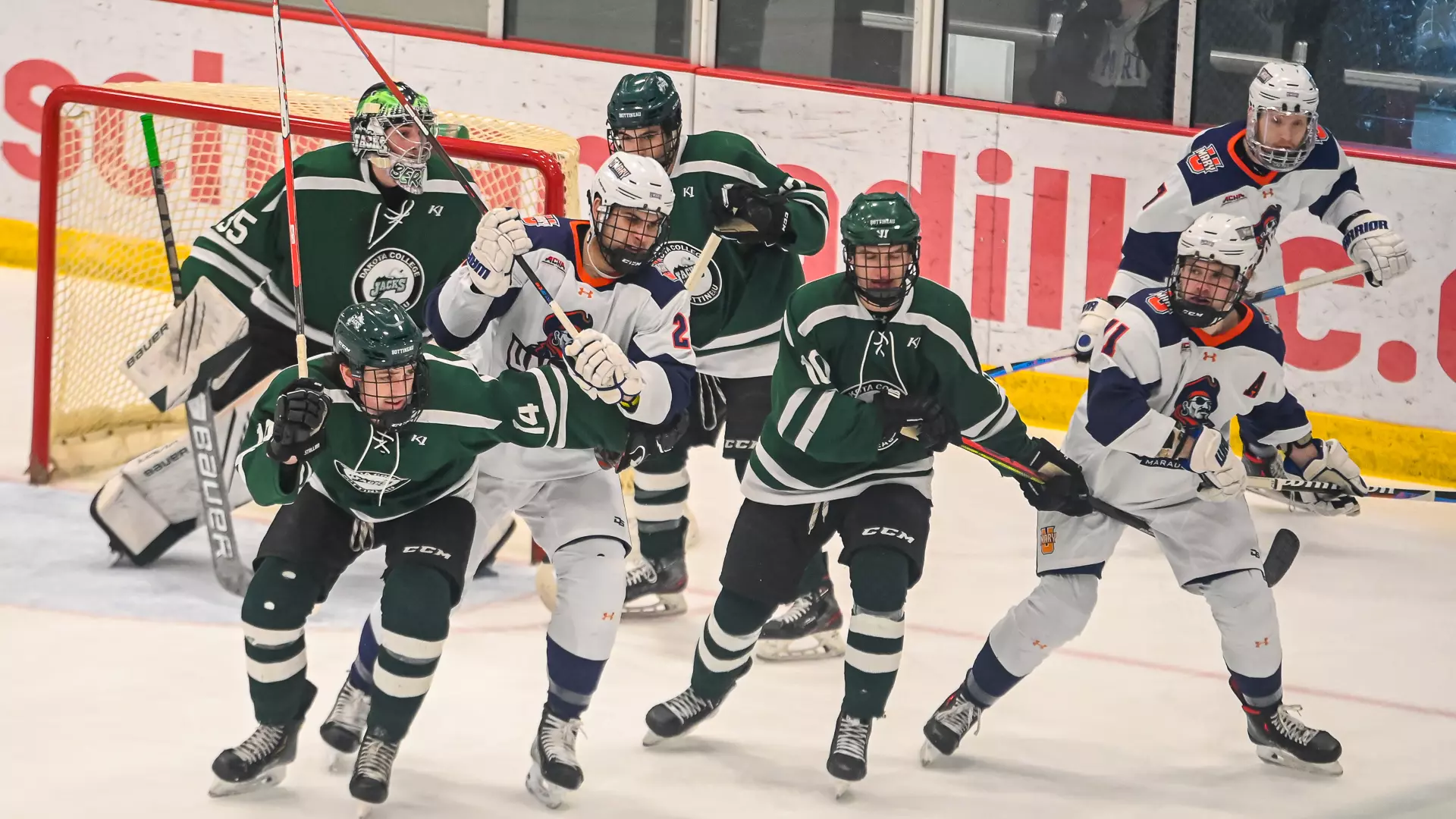 Marauders battle for the puck against the lumberjacks