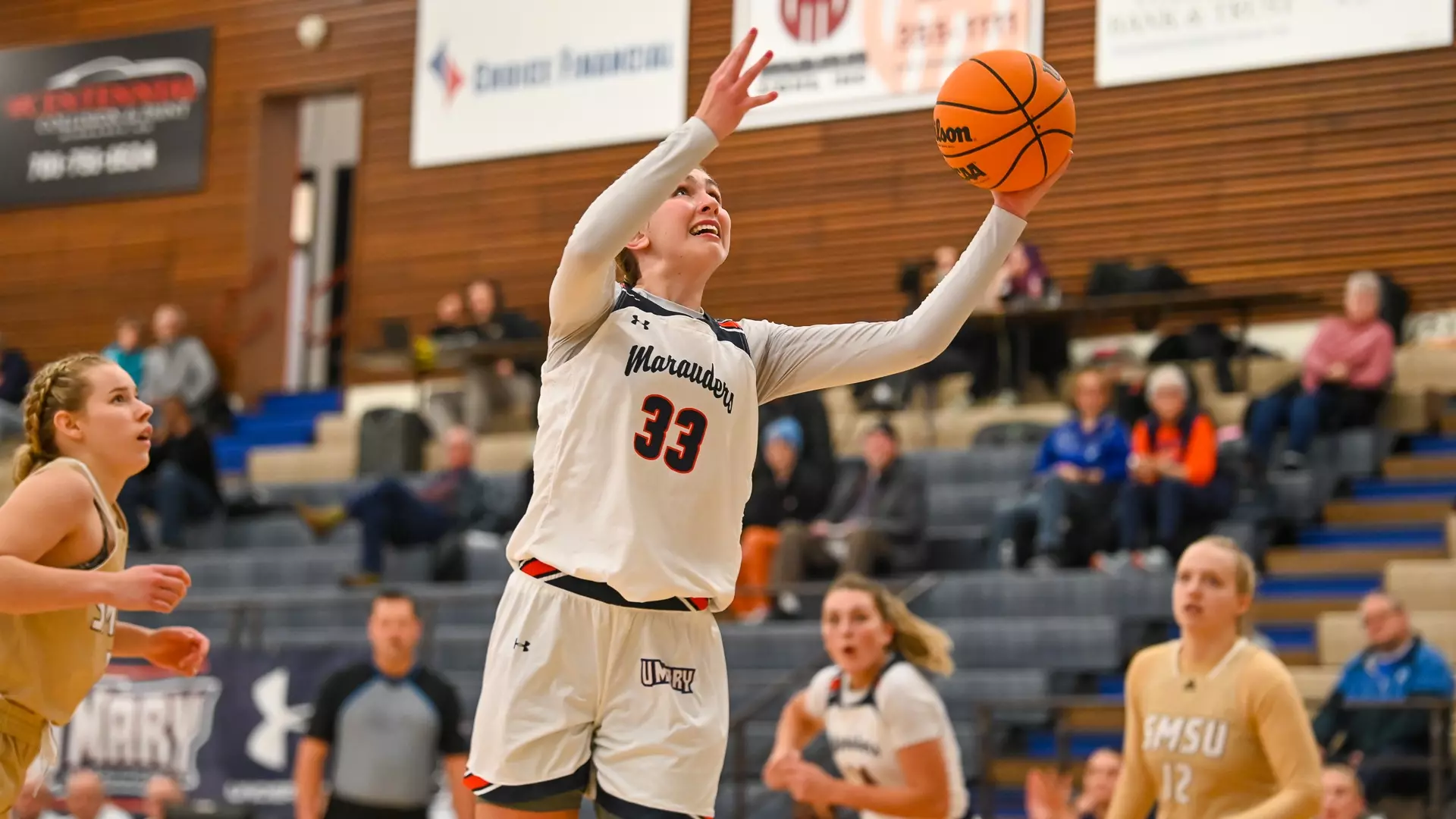 Rozell reaches for the layup vs Mustangs