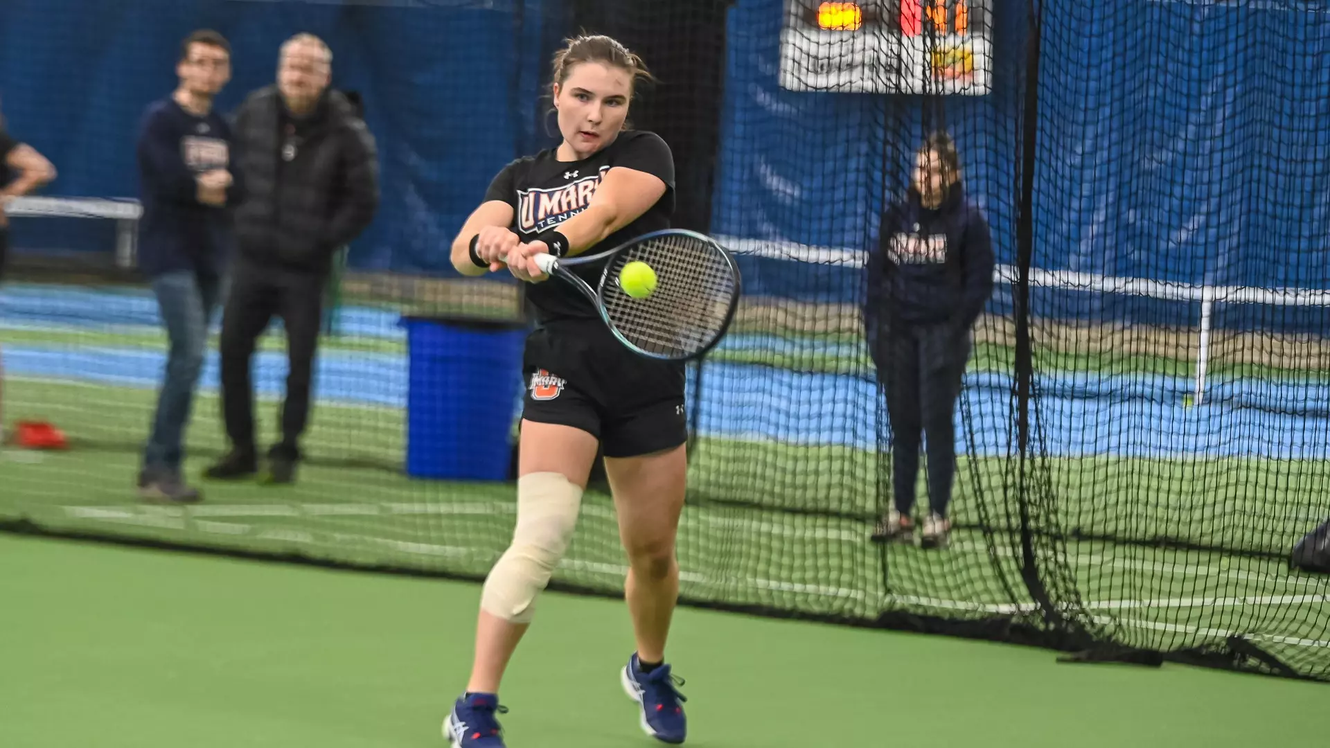 Ilona Freitag strikes the ball on a backhand
