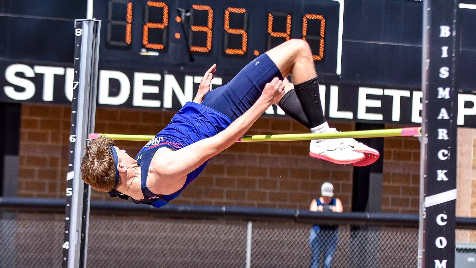 Logan Barnes clears the bar in the high jump