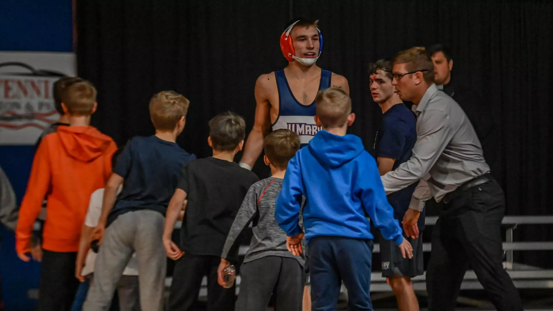 Kaden Renner greeted as he prepares to wrestle