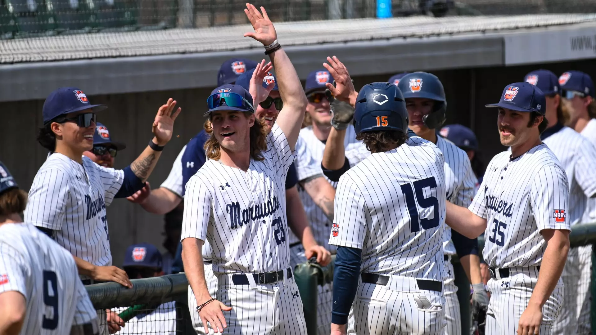 Marauders celebrate at the dugout
