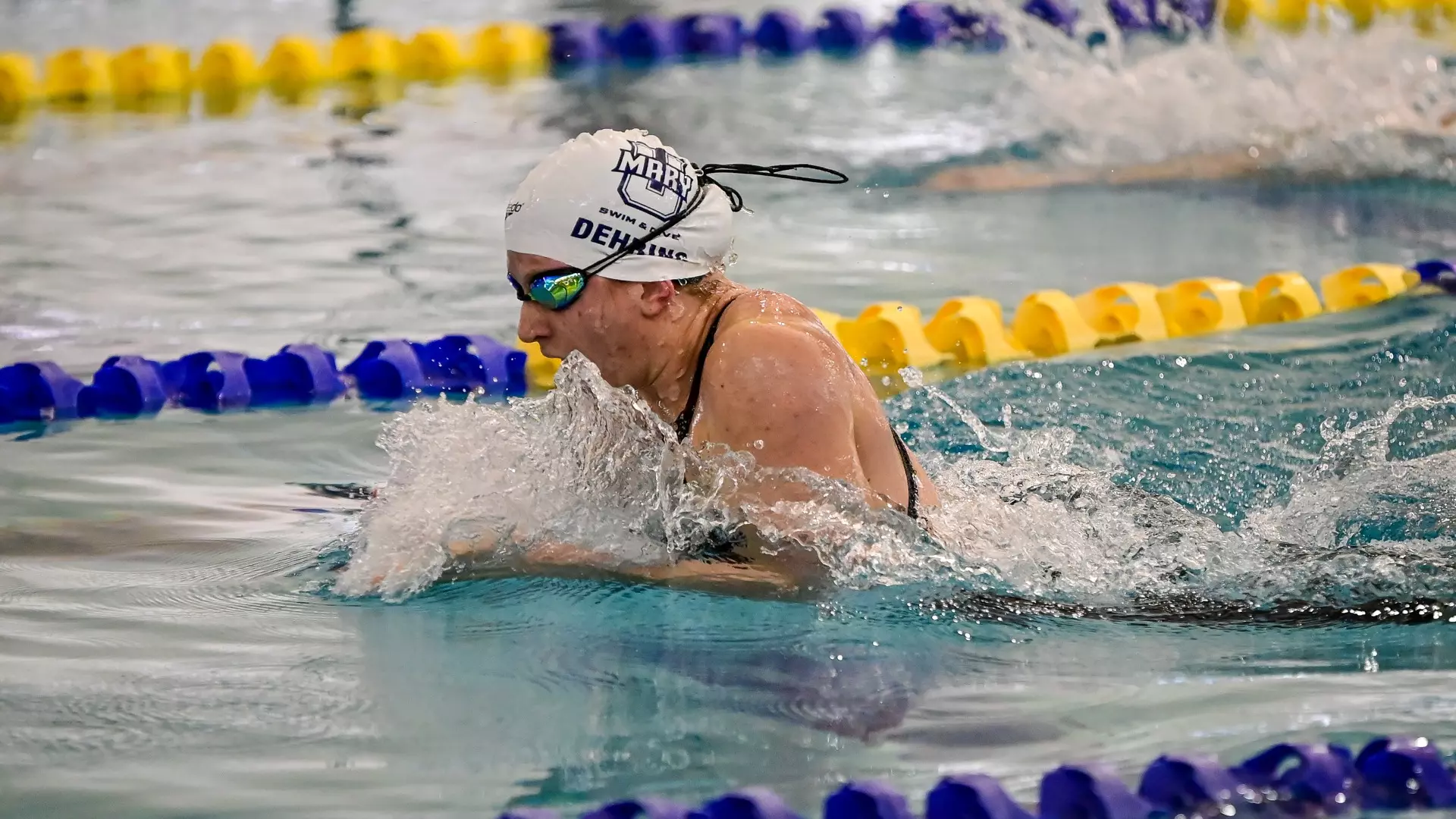 Natalie Derhing swimming against CC