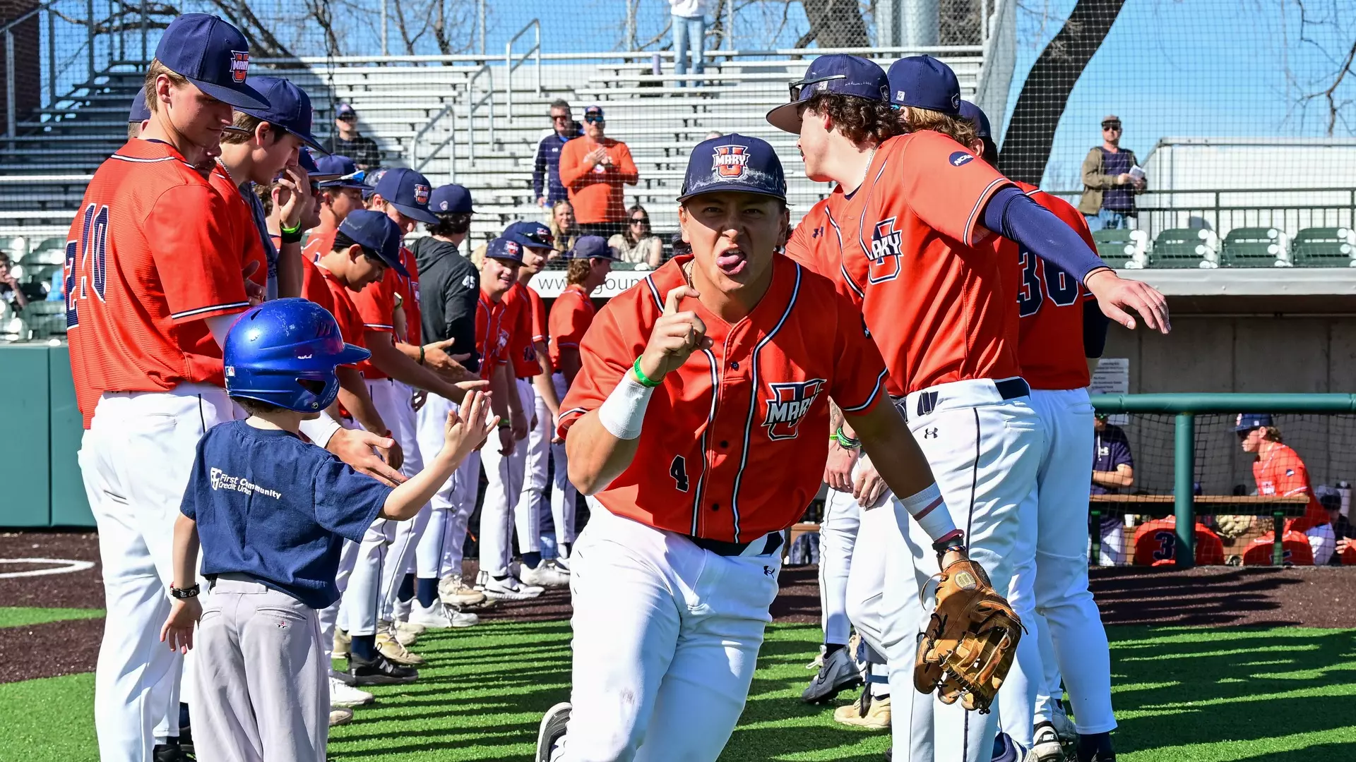 Luke Rhee leads team out of dugout