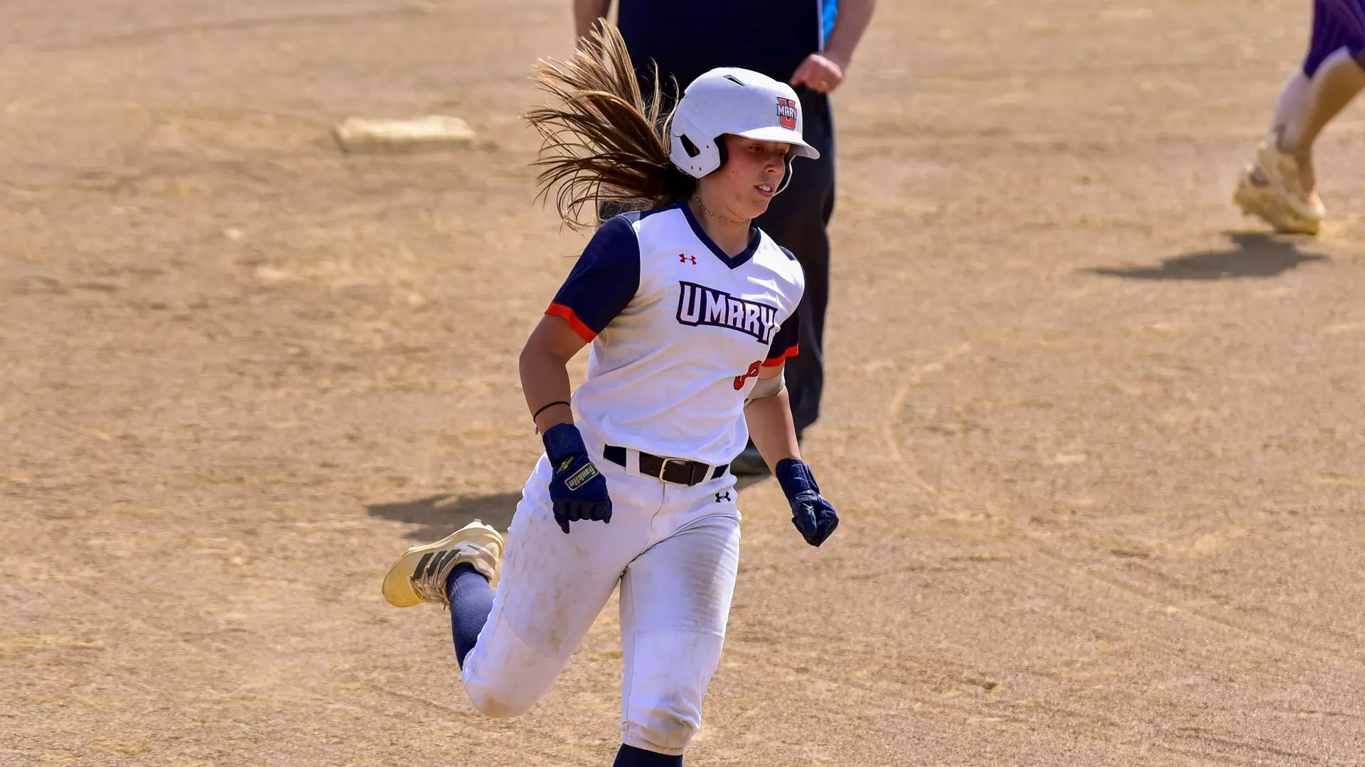 Genevieve Hastings rounding the bases after a home run