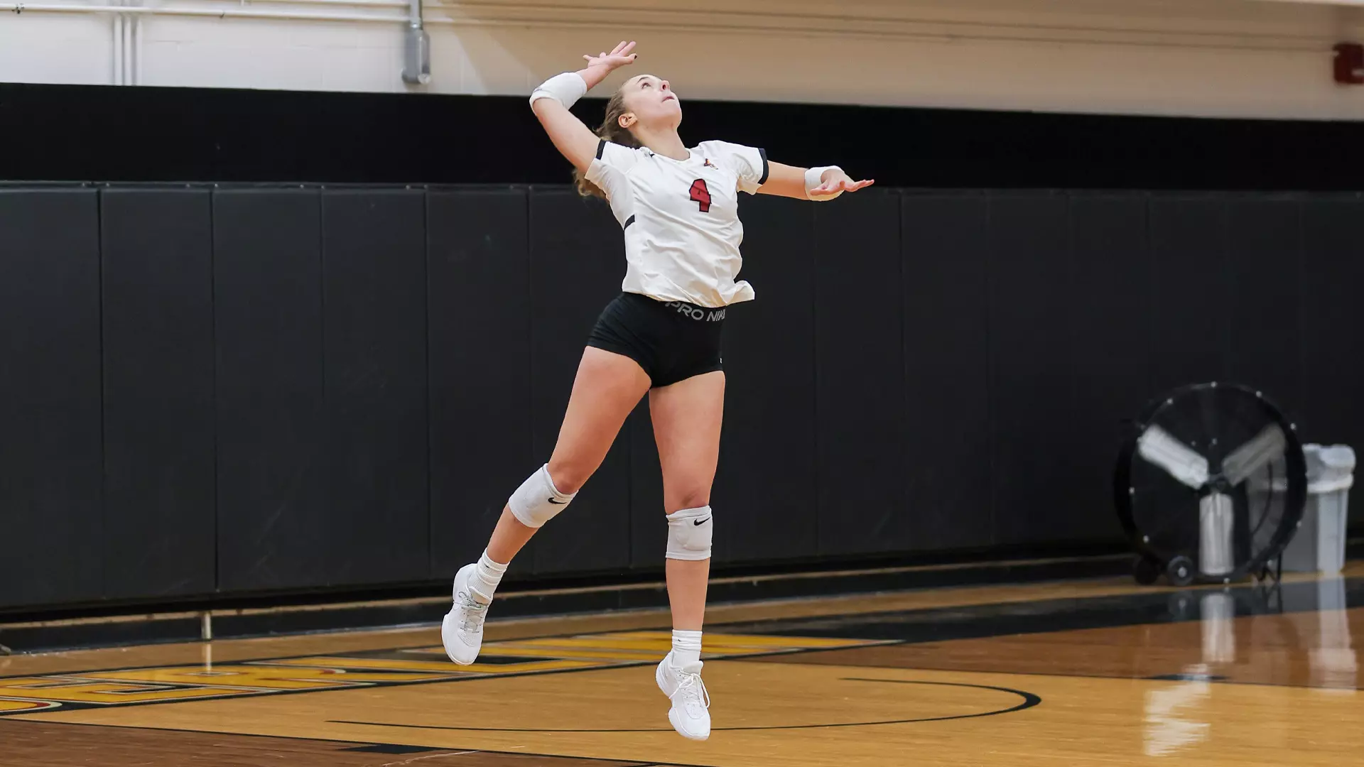 Josie Macdonald serving the ball