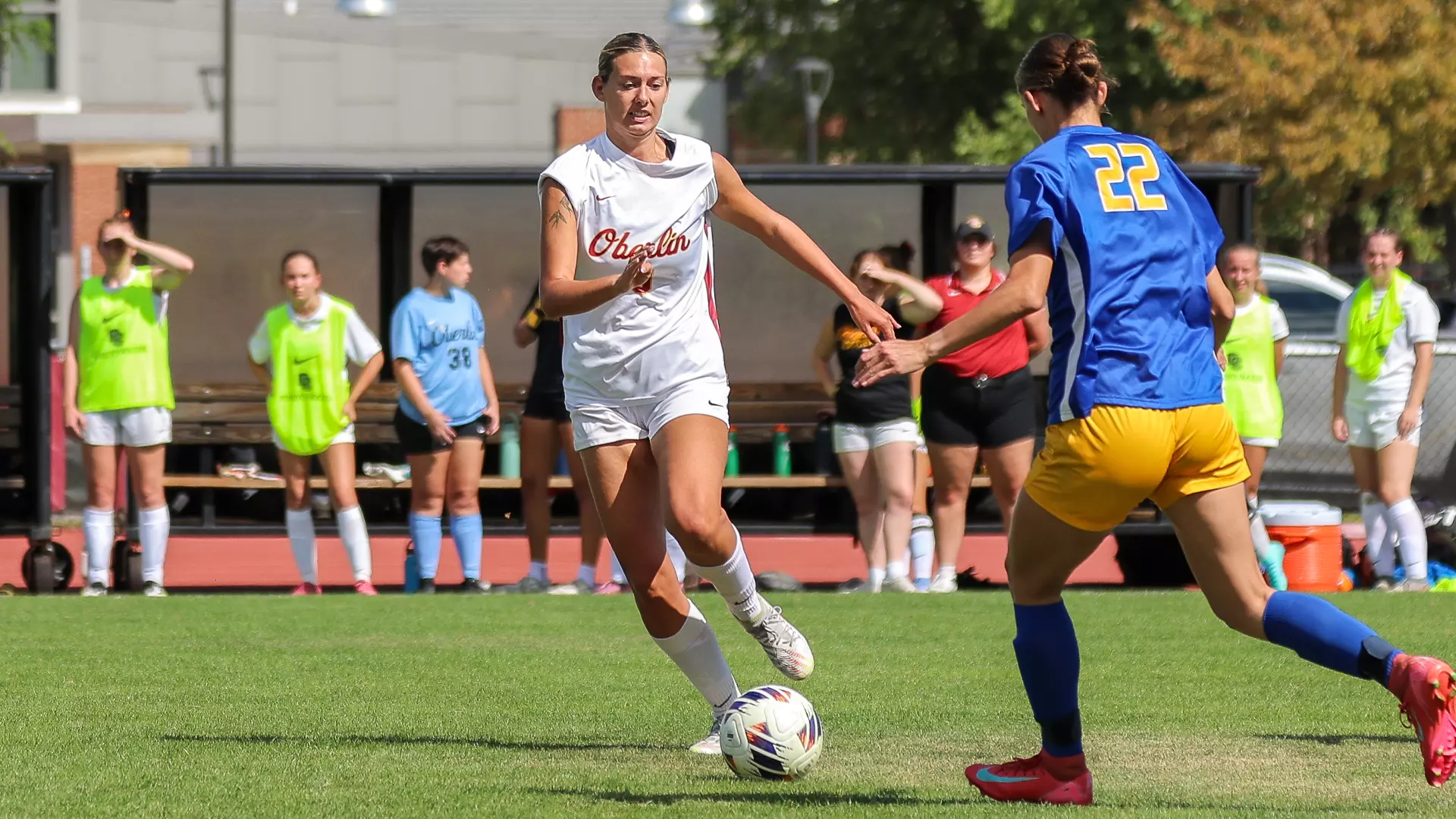 Madalyn New dribbles the ball in front of her