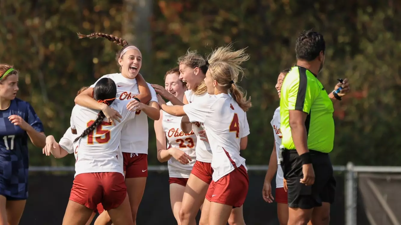 Women's Soccer Celebrating Team Goal - USC Header