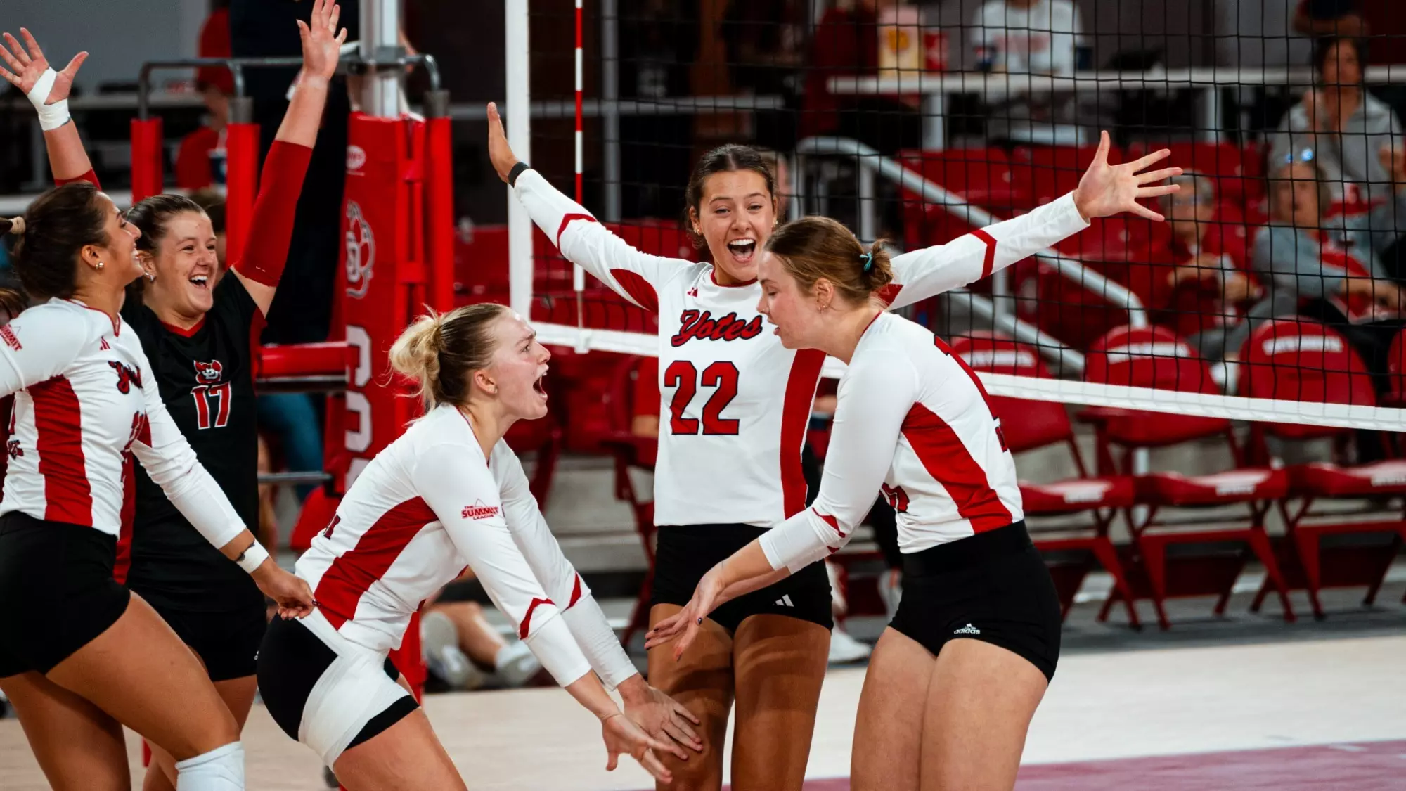 Avery Van Hook, Amelia Dugger and Carly Ries celebrating a point against Oral Roberts 9.27.25