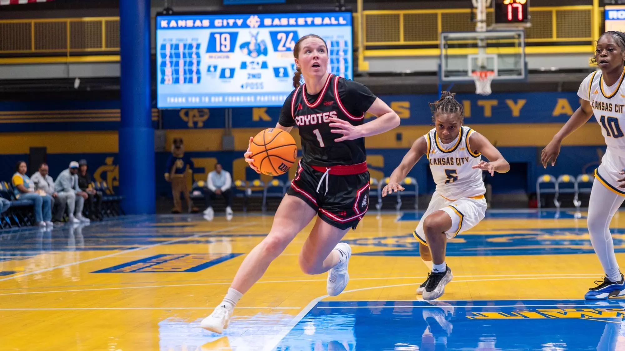 Molly Joyce drives to the basket against Kansas City in the Swinney Center in Kansas City