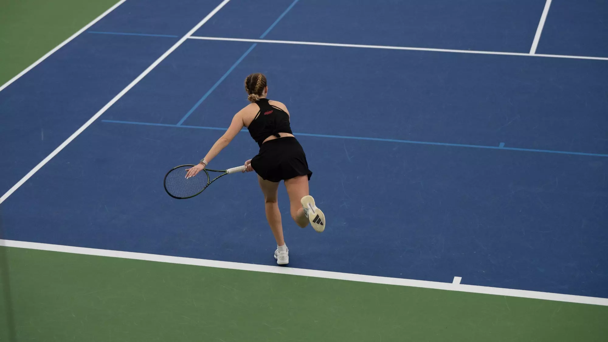 Anna serves to kick off first singles match of the day.