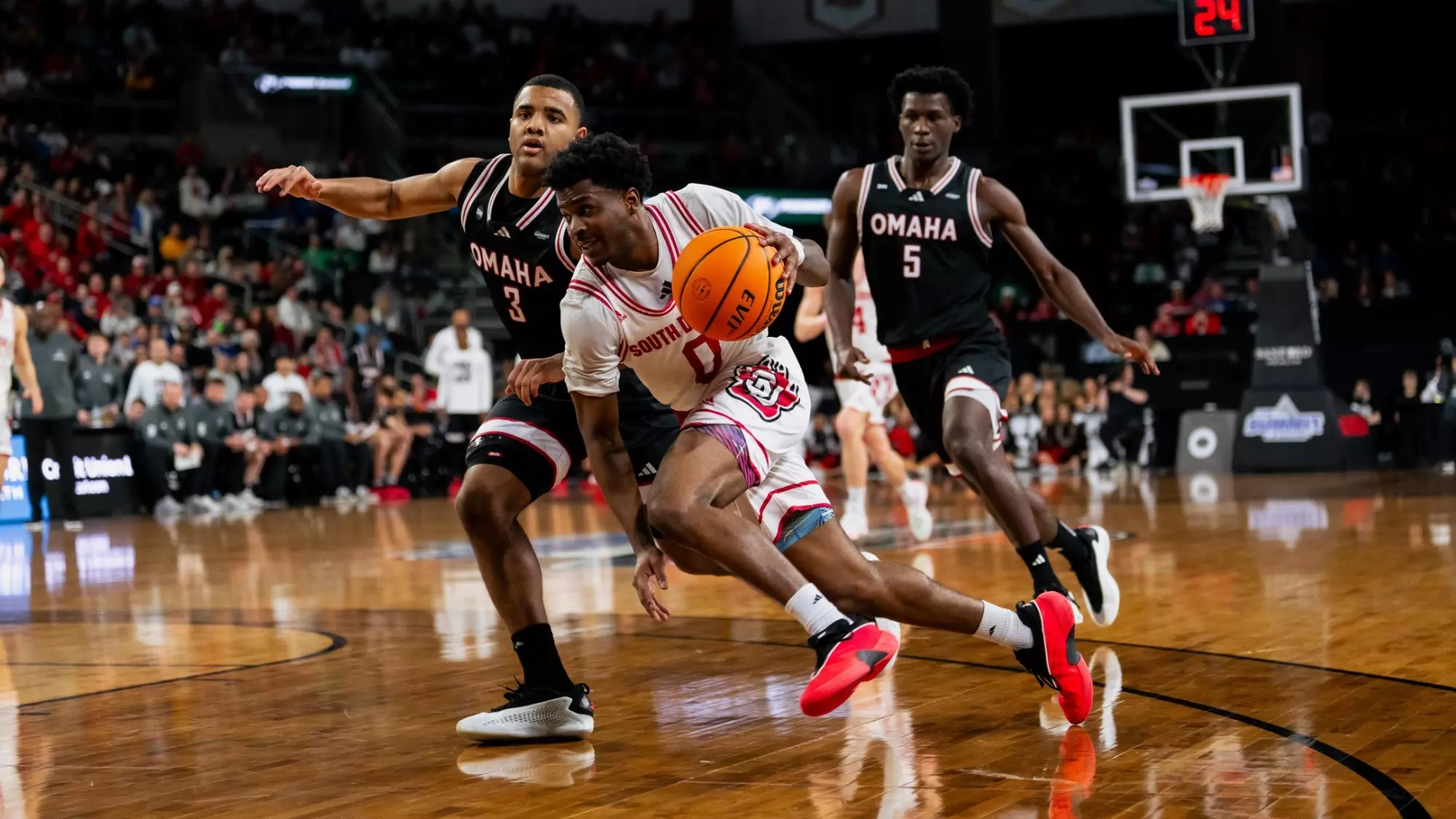 Jordan Crawford driving against Omaha at the Summit League Tournament