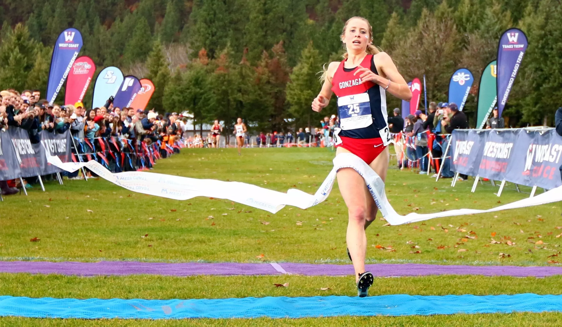 Shelby Mills crosses the line