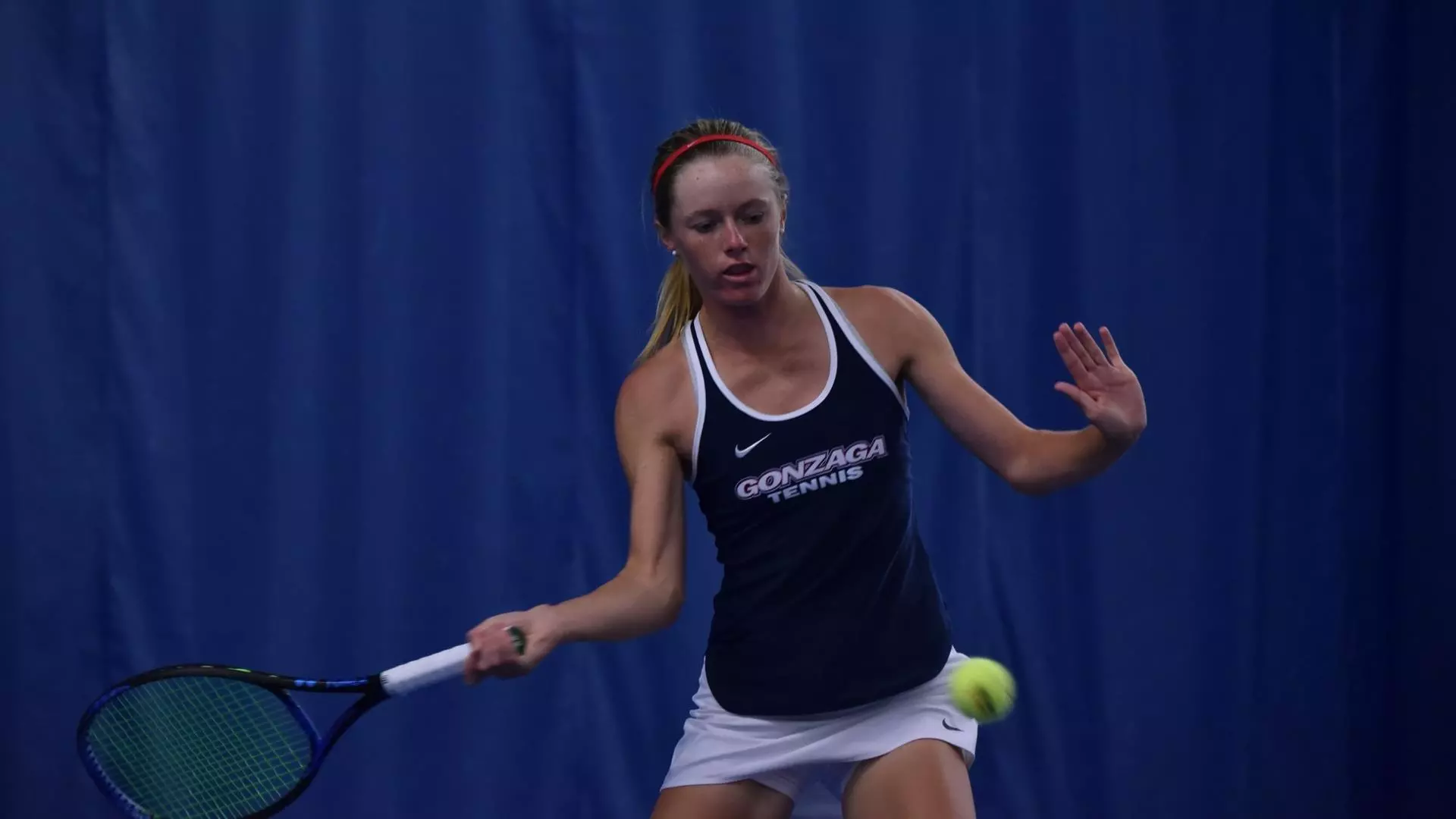 Cate Broerman hits a forehand