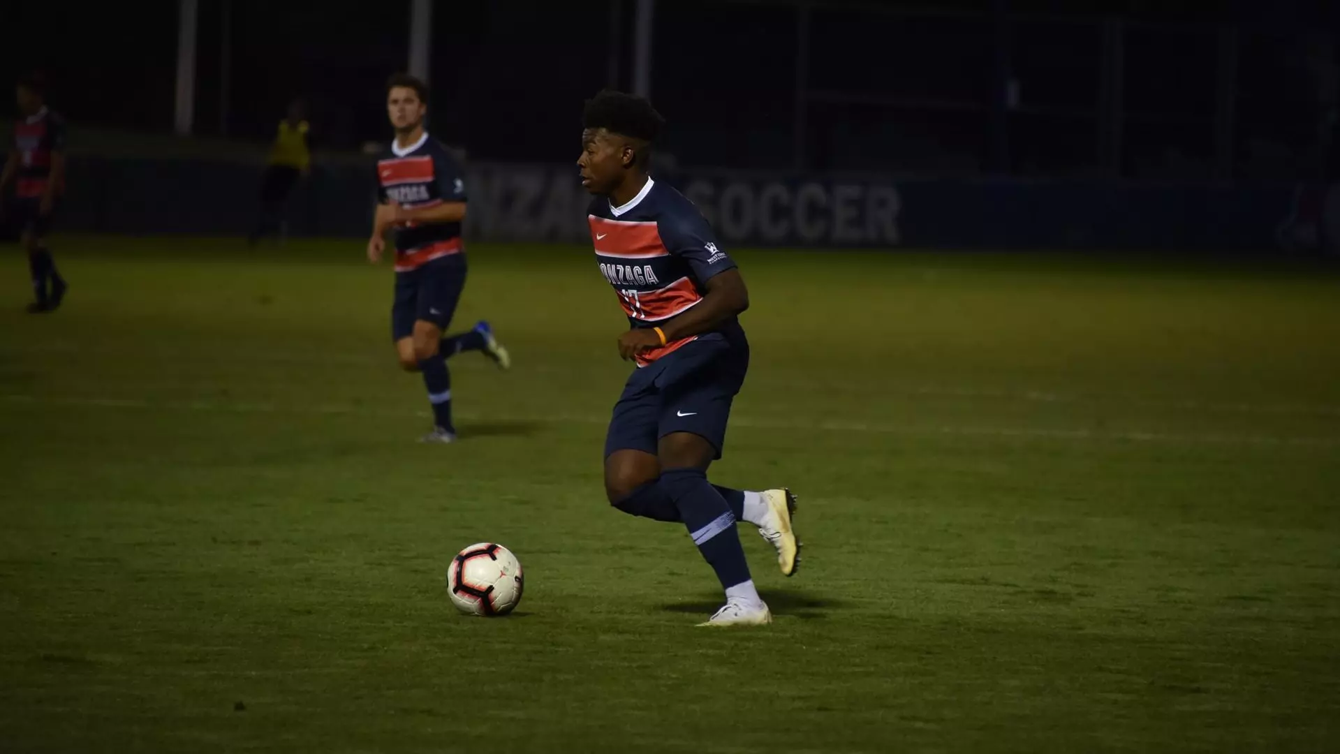 Demitrius Kigeya dribbles ball forward