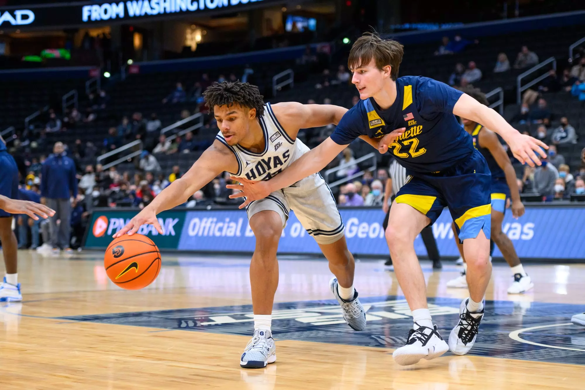 Collin Holloway fights for loose ball vs Marquette
