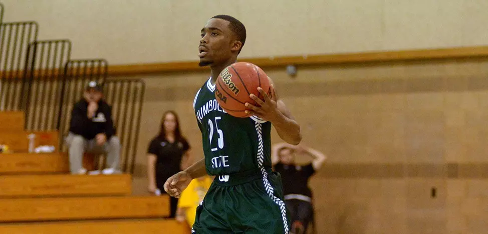Alan Guei brings the ball up the court.