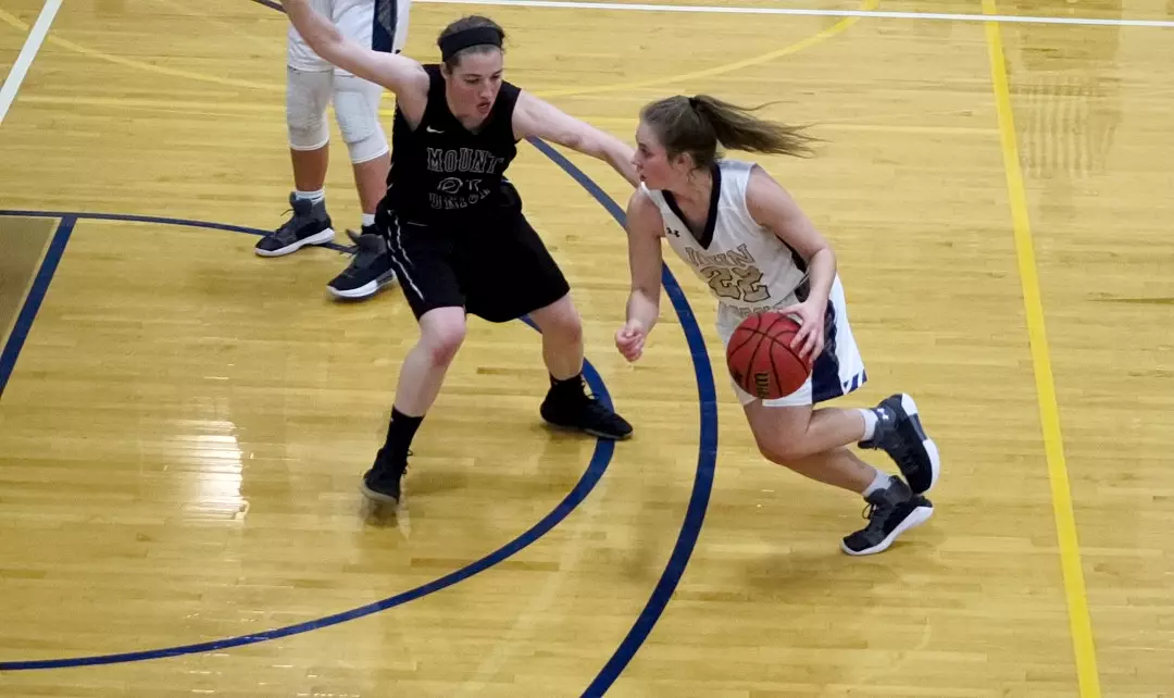 Labas looks to drive in the paint against a Mount Union defender.