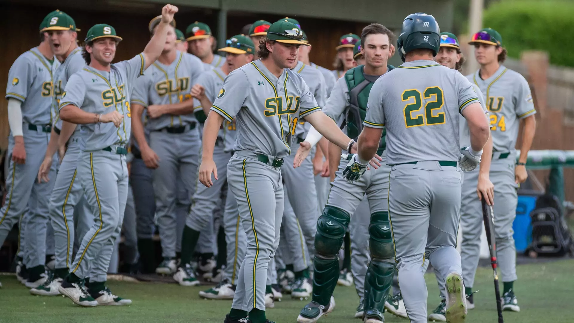 Preston Faulkner is congratulated heading back to the dugout following a home run.