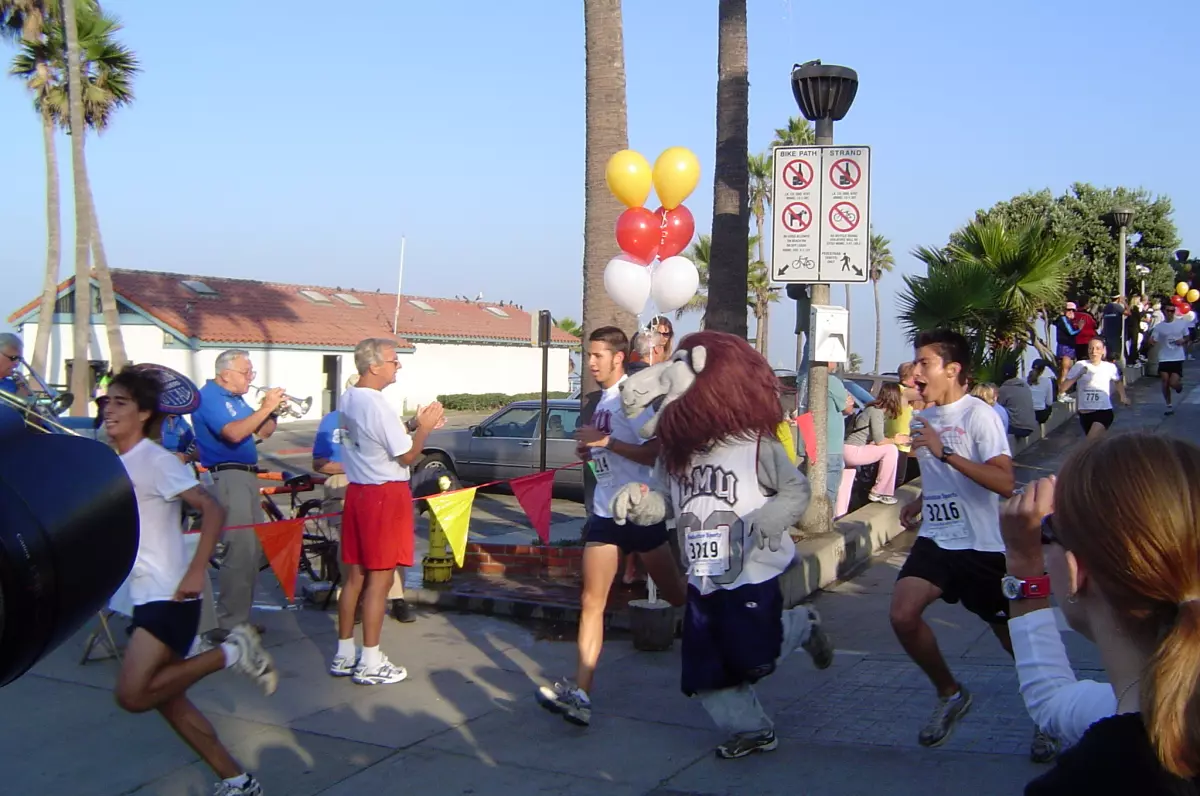 Iggy the Lion- with teammates Kenny Arehart and Reynaldo Barrera- was among the LMU finishers at the annual Alumni Run.