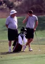 Father Higgins with one of his former players.