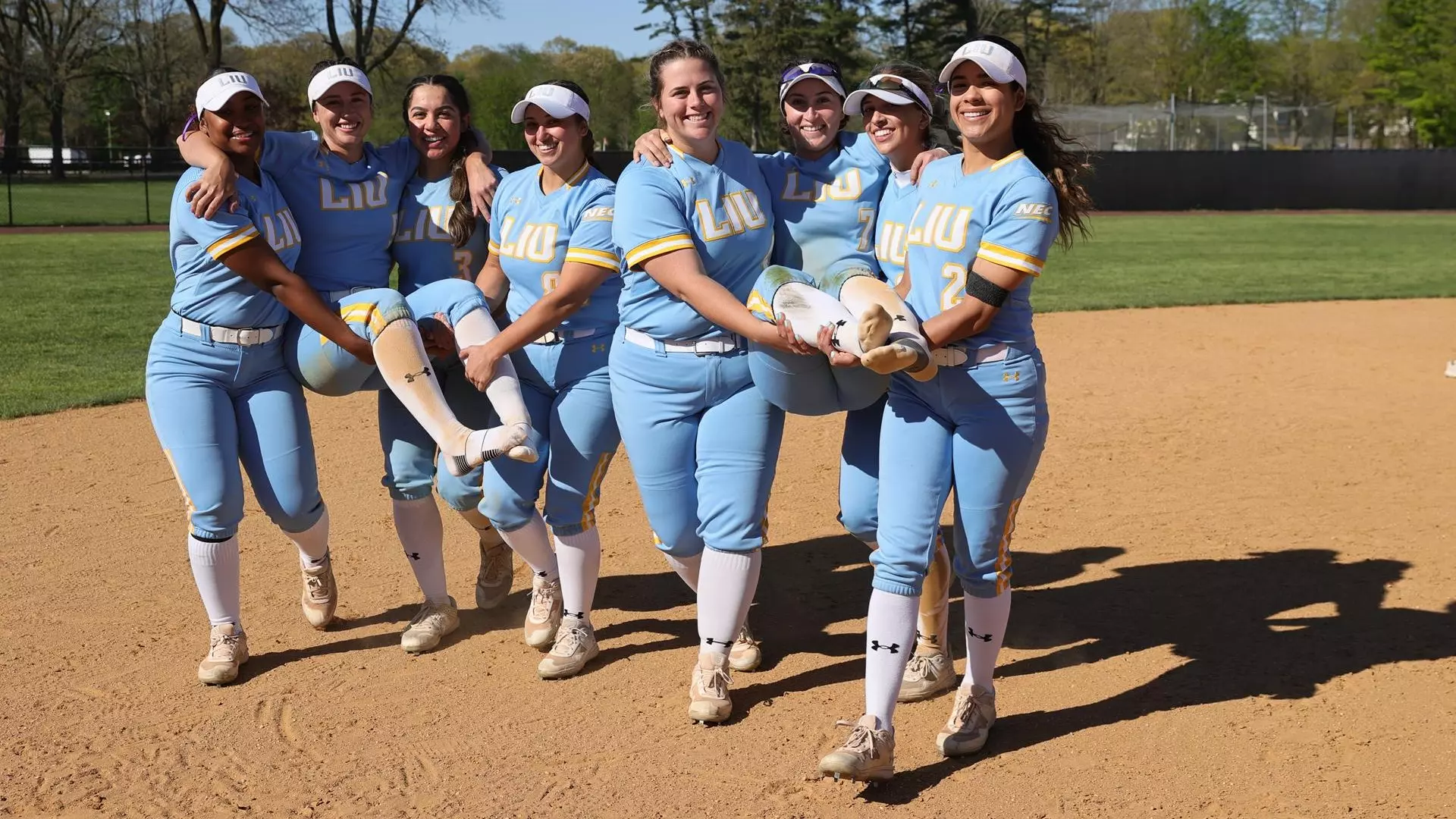 Teammates carry seniors off the field after Monday's home finale.
