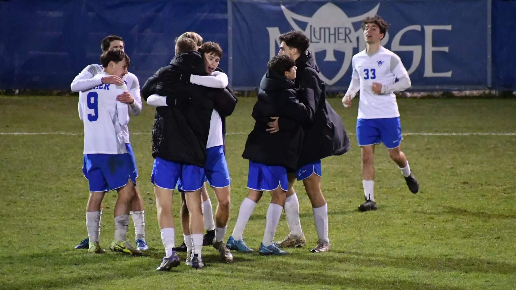 Soccer players hug after victory over Central in A-R-C Semifinal 11.5.25