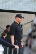 Coach Ty Singleton watches his team as they compete against Drake.
