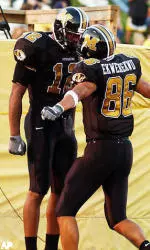 Missouri receivers Sean Coffey, left, and Brad Ekwerekwu celebrate after Coffey caught a 60-yard touchdown pass Saturday, Sept. 4, 2004, in the first half against Arkansas State in Columbia.