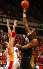 Kalen Grimes goes up for a shot over Iowa State's Jard Homan during the first half.