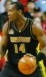 Missouri's Kevin Young dribbles the basketball past Texas Tech's Jon Plefka in the first half. (AP Photo/The Lubbock Avalanche-Journal, Joe Don Buckner)