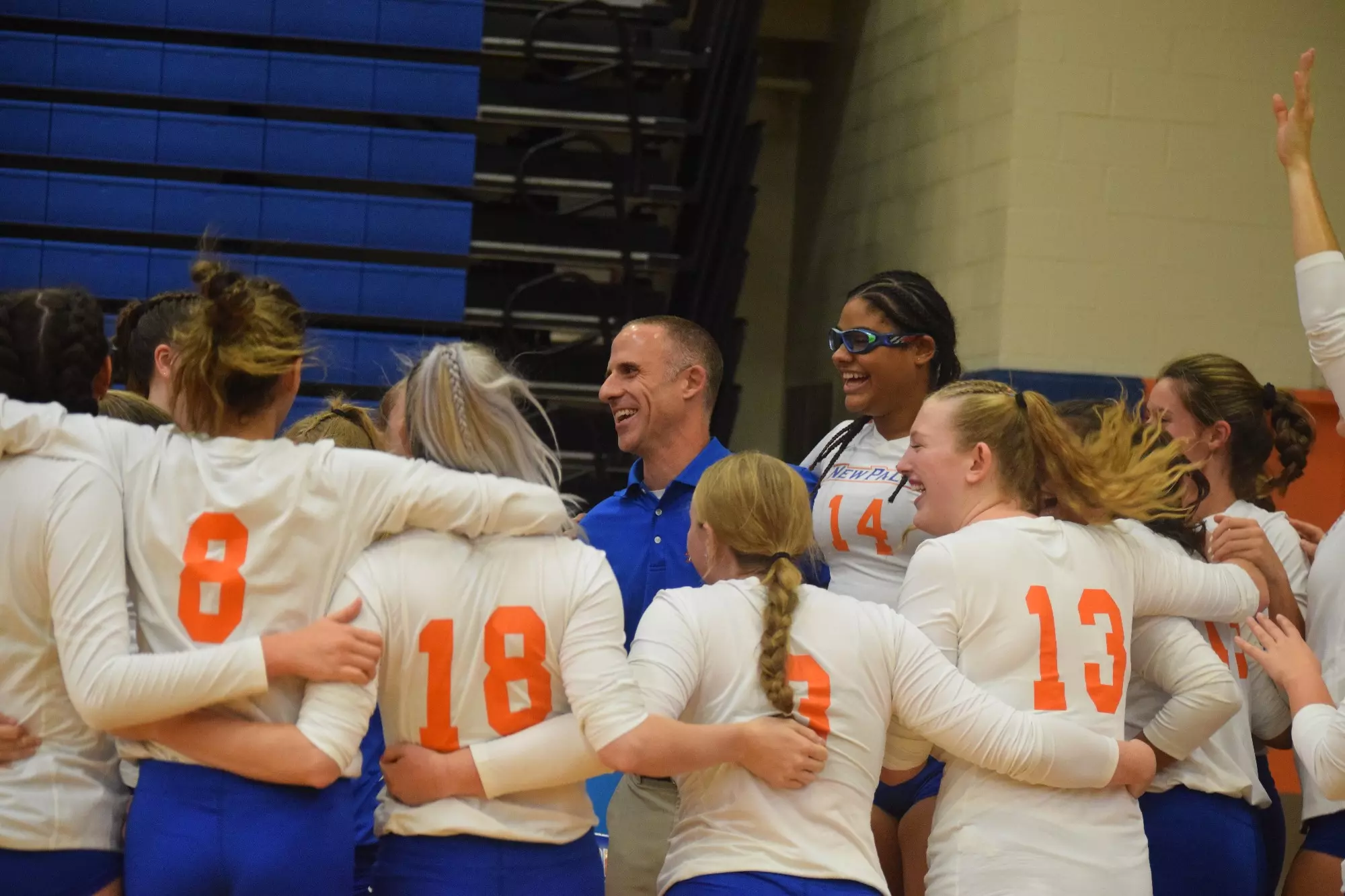 The Hawks celebrate coach Matt Giufre after his 500th win. 