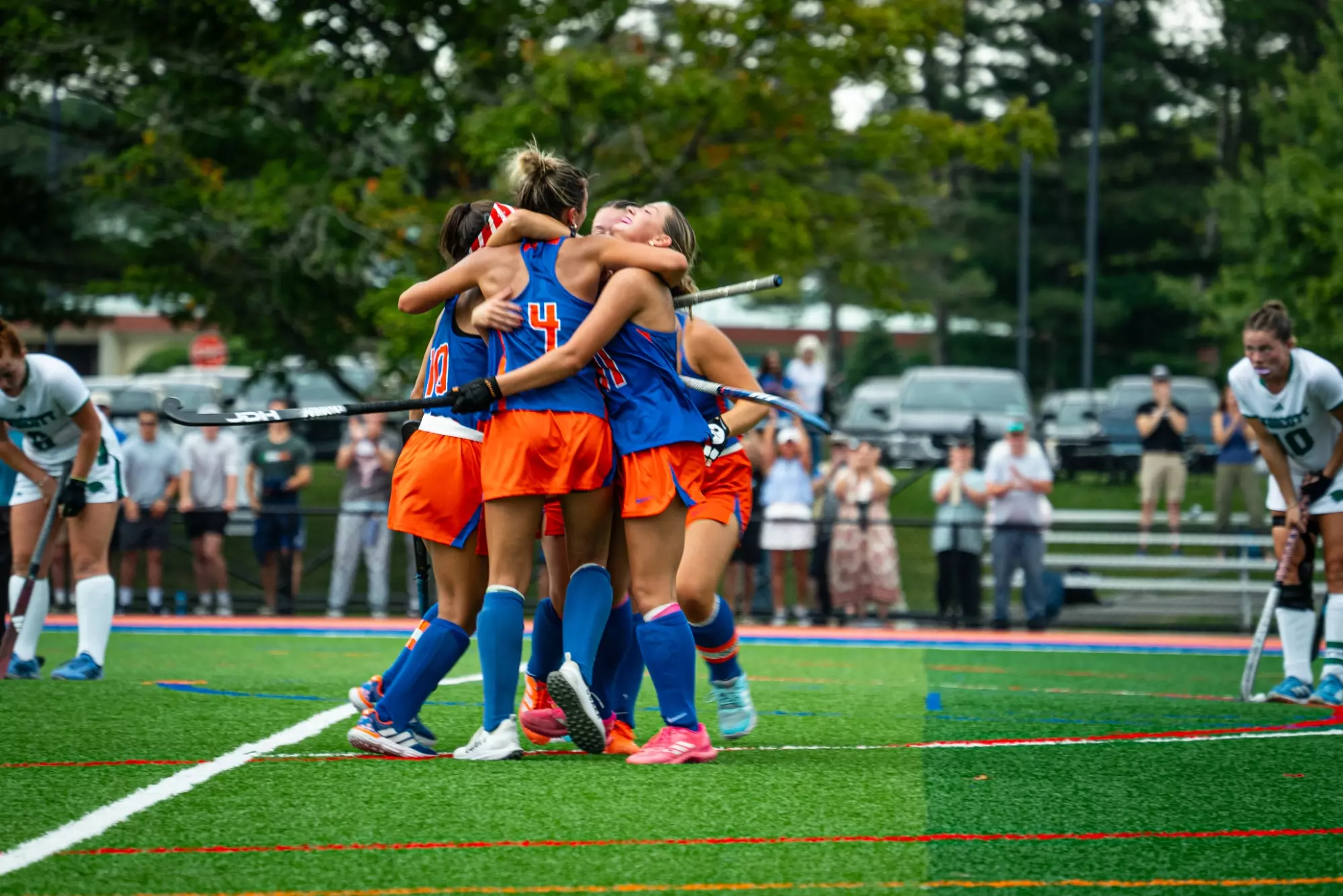 Maya O'Keefe celebrates with her teammates after her goal