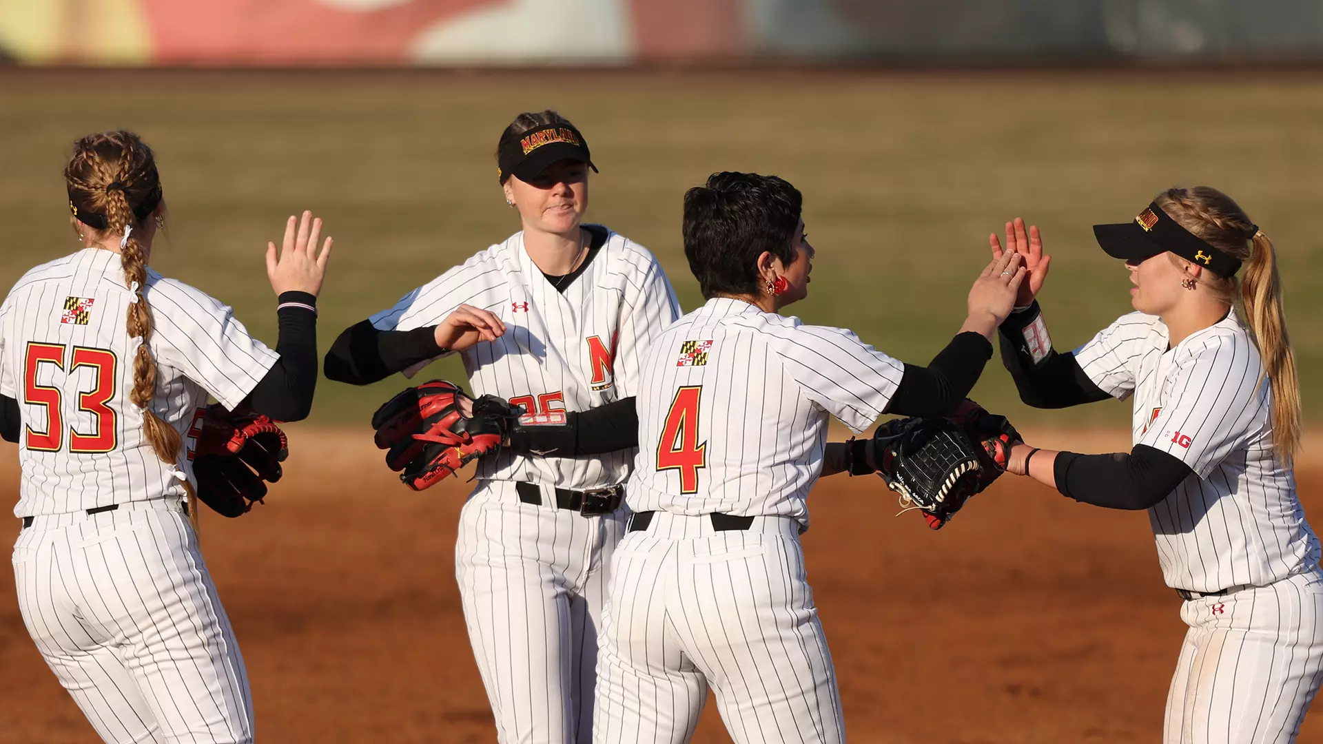 Maryland Celebrates a Defensive Play Against Syracuse