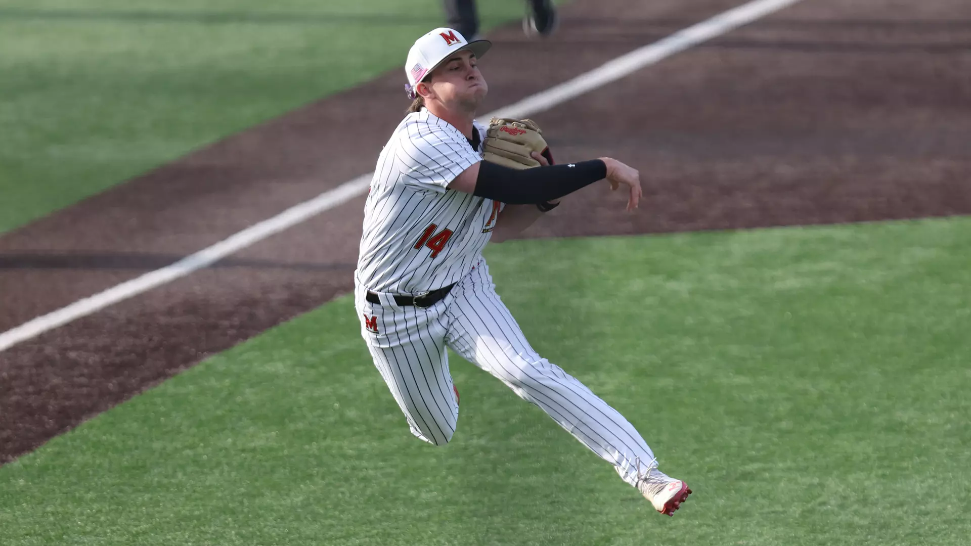 Jackson Sirois Fires a Ball to First Base Against Purdue