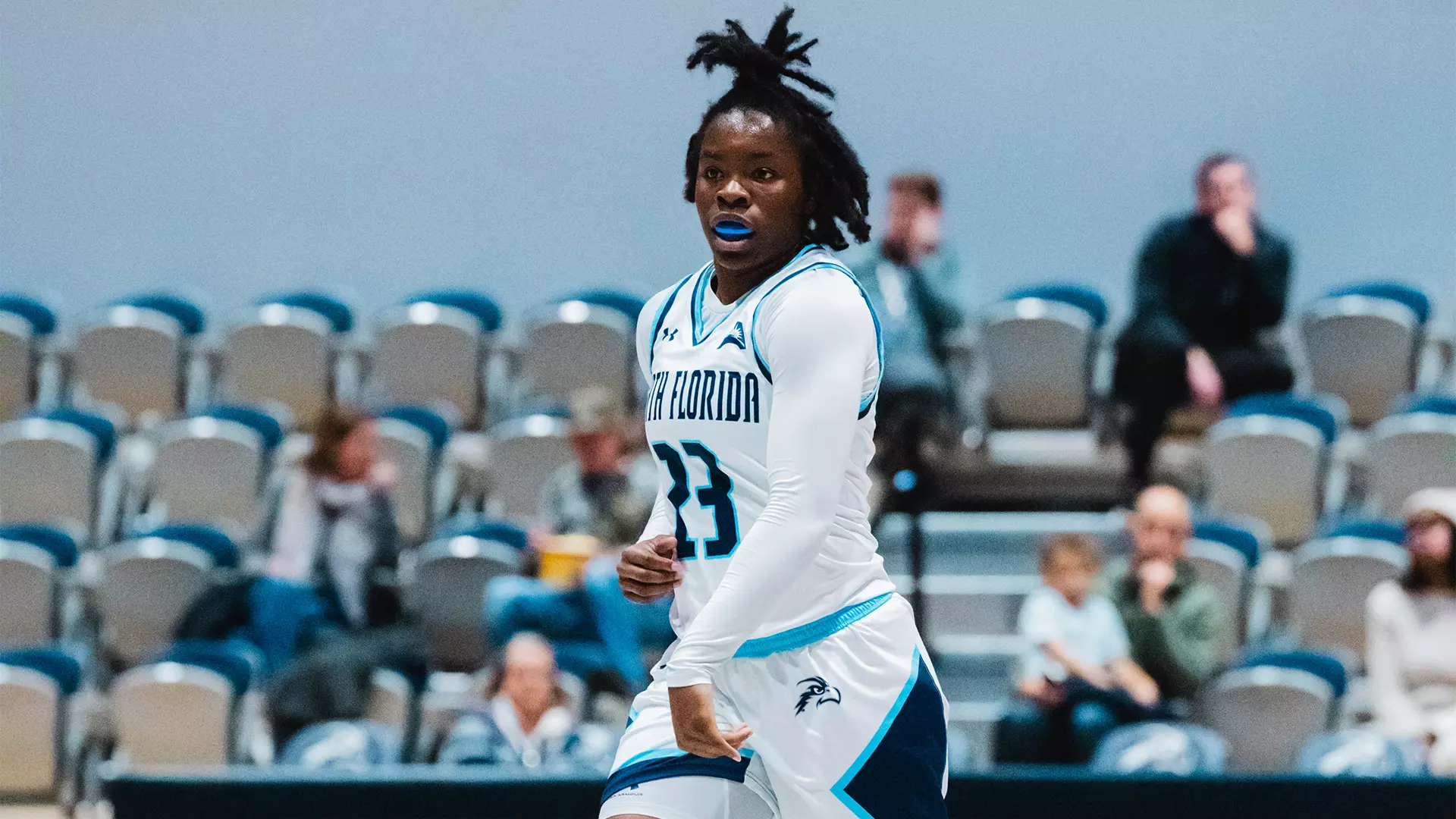 Kaila Rougier driving the ball up court